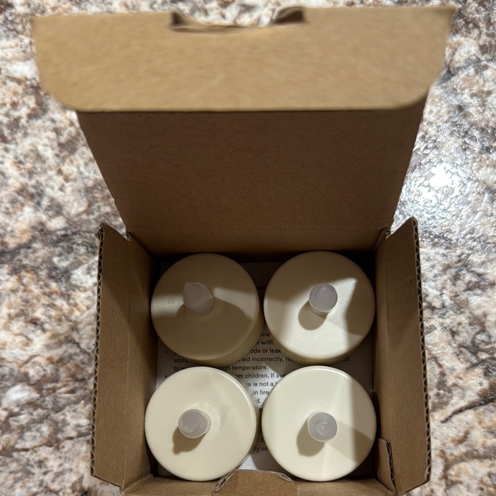 Pottery Barn Set of 4 Cream Tealight Candles